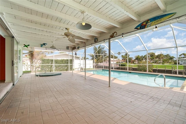 view of swimming pool featuring a lanai, a patio area, and a fenced in pool