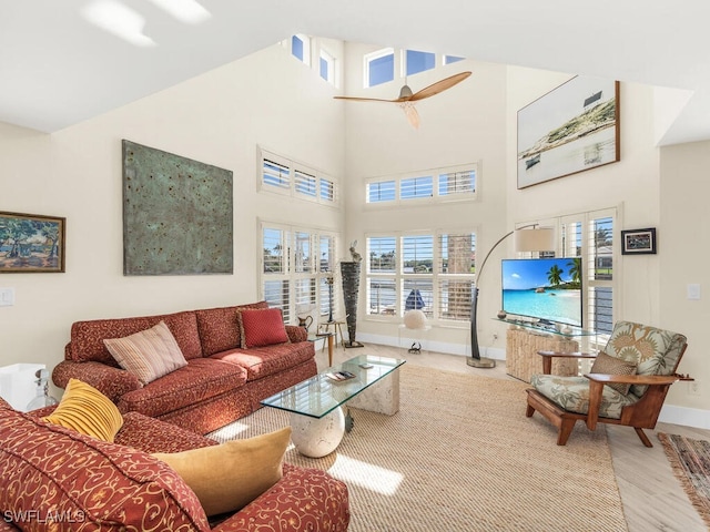 living room featuring a high ceiling and hardwood / wood-style floors