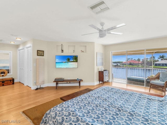 bedroom featuring ceiling fan, access to outside, and wood-type flooring