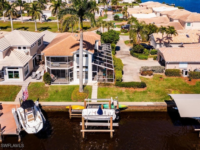 birds eye view of property featuring a water view