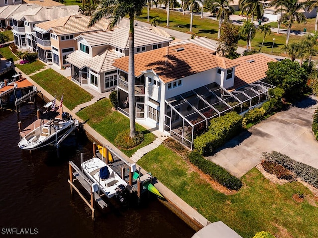 birds eye view of property with a water view