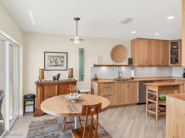 interior space with light hardwood / wood-style flooring and sink