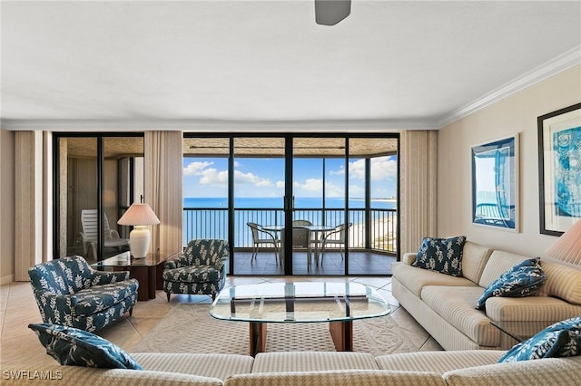 living room featuring expansive windows, a water view, light tile patterned flooring, and crown molding