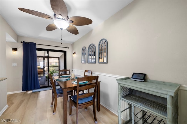 dining area with ceiling fan and light hardwood / wood-style floors