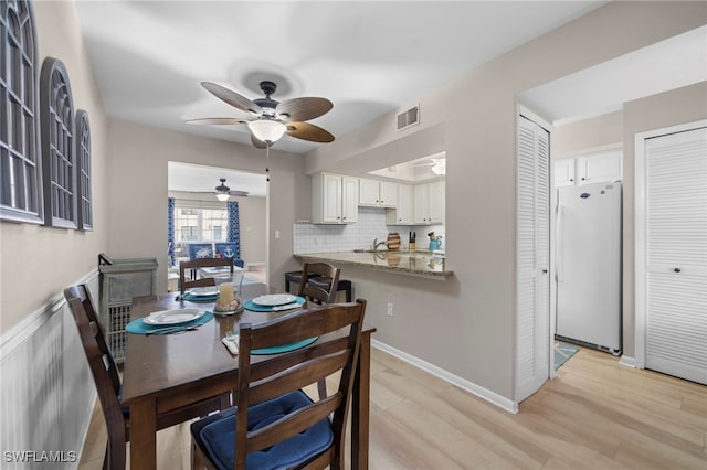 dining area featuring light hardwood / wood-style flooring