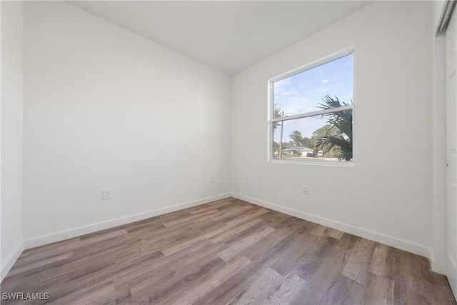 spare room featuring light hardwood / wood-style flooring