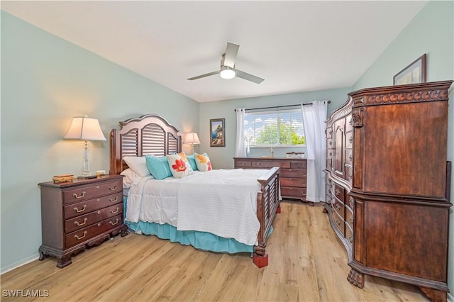 bedroom with a ceiling fan and light wood-type flooring