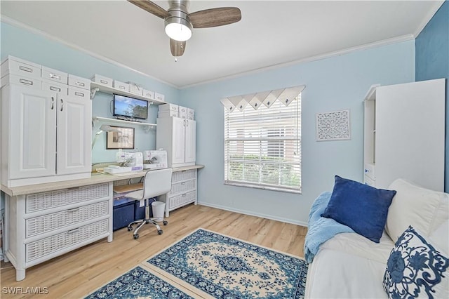 office space featuring ceiling fan, ornamental molding, and light wood-style floors