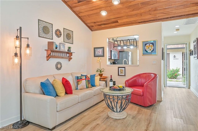 living room featuring lofted ceiling, visible vents, wood finished floors, wooden ceiling, and baseboards