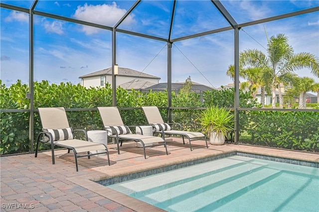 view of pool featuring a lanai and a patio