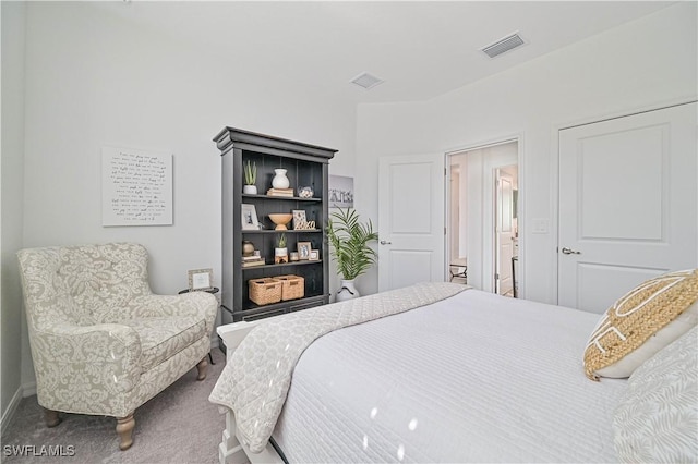 carpeted bedroom with visible vents