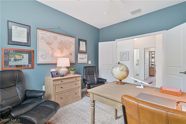 office area featuring visible vents and baseboards