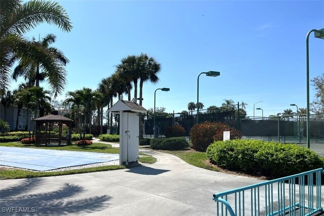 view of community featuring fence and a gazebo