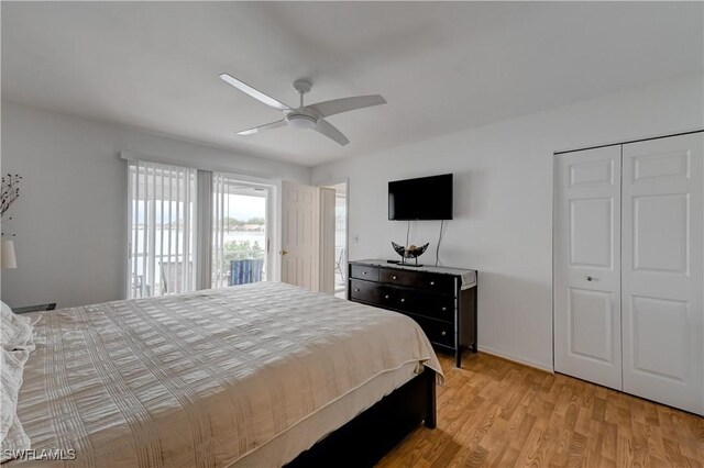 bedroom with light wood-type flooring and a ceiling fan