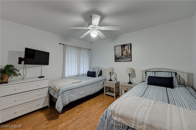 bedroom featuring ceiling fan and light wood-style floors