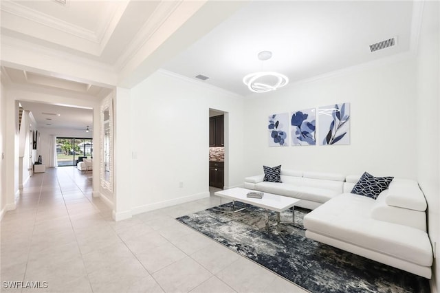 living area featuring baseboards, light tile patterned flooring, visible vents, and crown molding