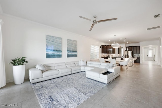 3275 Pilot Cir, Naples, FL 34120 - living room with crown molding, light tile patterned floors, a ceiling fan, and recessed lighting