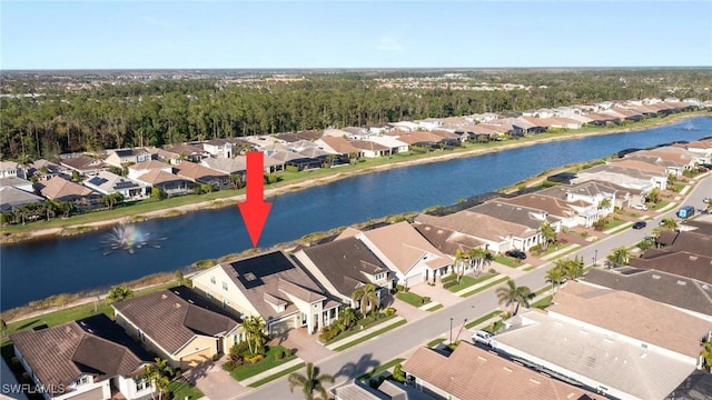 aerial view featuring a residential view and a water view