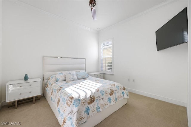 bedroom featuring baseboards, ornamental molding, and light colored carpet