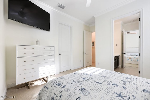 bedroom featuring visible vents, ornamental molding, light carpet, ensuite bath, and baseboards