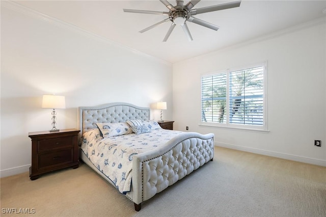 bedroom with a ceiling fan, light colored carpet, crown molding, and baseboards