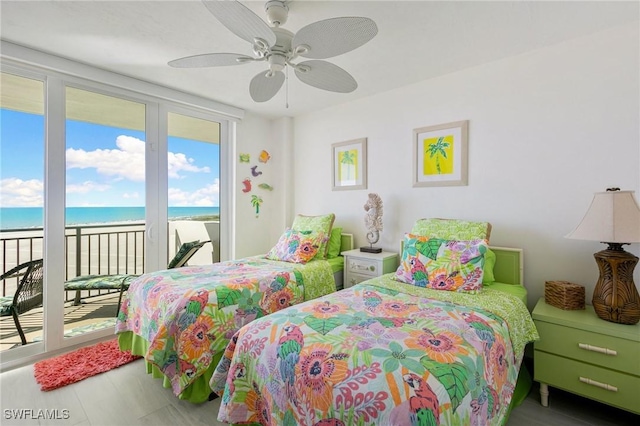 180 Seaview Ct Unit 911, Marco Island, FL 34145 - bedroom with access to outside, a water view, and a ceiling fan