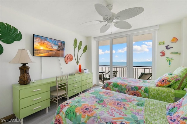 180 Seaview Ct Unit 911, Marco Island, FL 34145 - bedroom featuring an office area, access to exterior, wood finished floors, and a ceiling fan