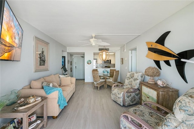 180 Seaview Ct Unit 911, Marco Island, FL 34145 - living room with ceiling fan and wood finished floors