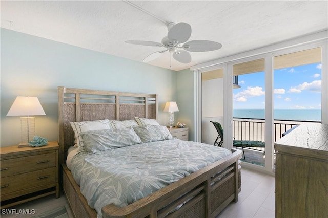 180 Seaview Ct Unit 911, Marco Island, FL 34145 - bedroom with access to outside, a water view, and a ceiling fan