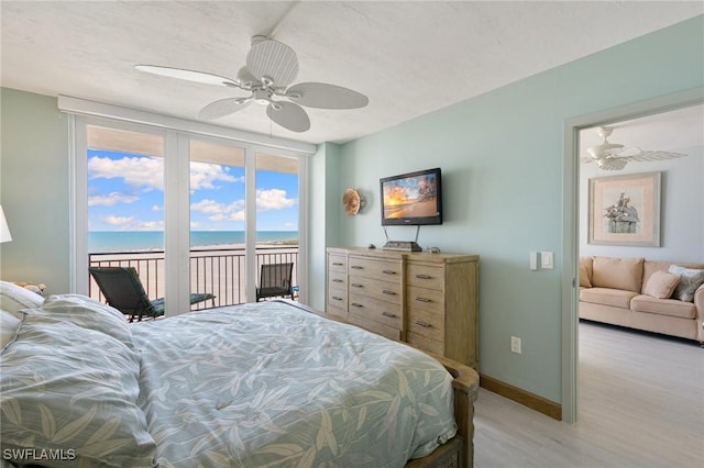 180 Seaview Ct Unit 911, Marco Island, FL 34145 - bedroom with access to exterior, light wood-style flooring, baseboards, and ceiling fan