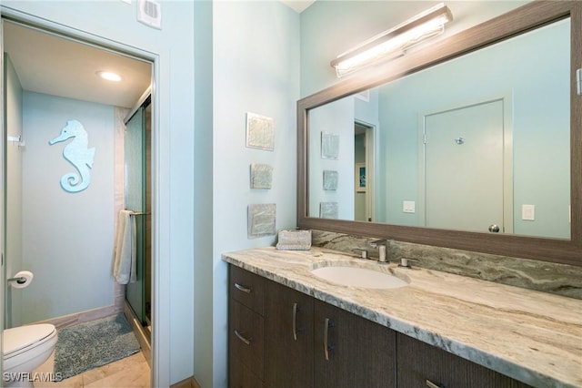 180 Seaview Ct Unit 911, Marco Island, FL 34145 - bathroom featuring vanity, toilet, and a shower stall