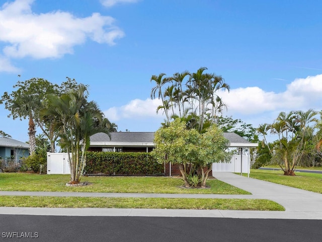 view of front of house with a front yard and driveway