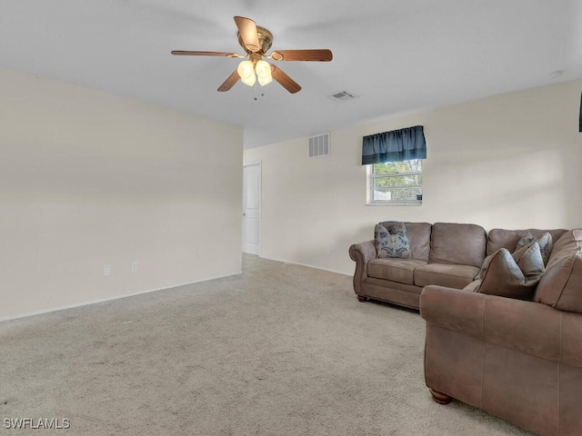 living area featuring ceiling fan, light carpet, and visible vents