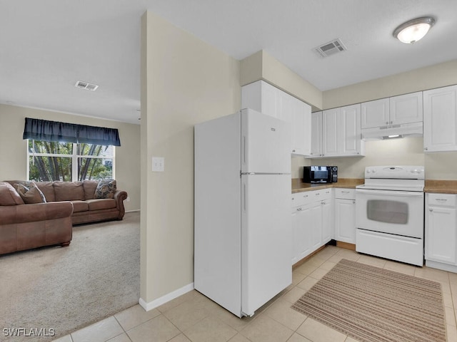 kitchen featuring under cabinet range hood, white appliances, visible vents, open floor plan, and light countertops