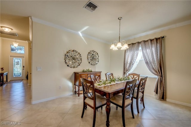 dining space with a notable chandelier, visible vents, a wealth of natural light, and ornamental molding