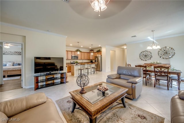 living area featuring light tile patterned floors, recessed lighting, ceiling fan with notable chandelier, baseboards, and crown molding