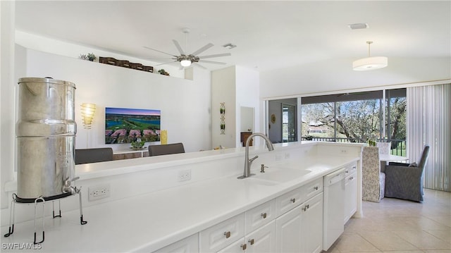 kitchen with a sink, white cabinets, light countertops, hanging light fixtures, and dishwasher