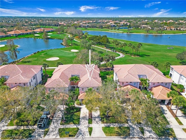 birds eye view of property with a water view, a residential view, and golf course view