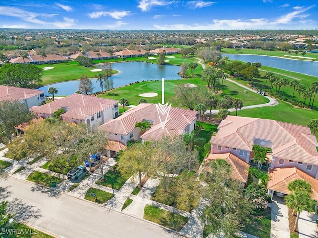 birds eye view of property with a water view, view of golf course, and a residential view