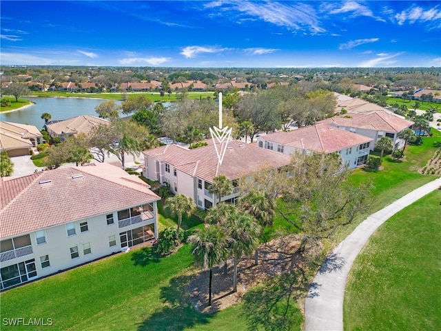 bird's eye view with a residential view and a water view