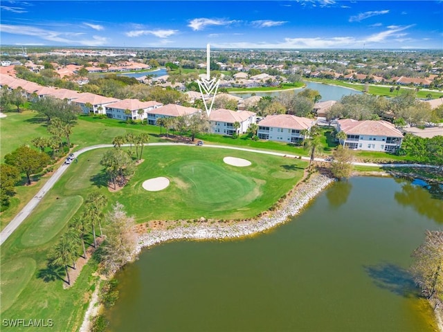 birds eye view of property with a water view, a residential view, and golf course view