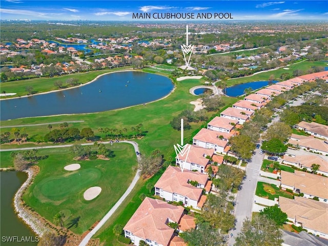 birds eye view of property with golf course view, a water view, and a residential view