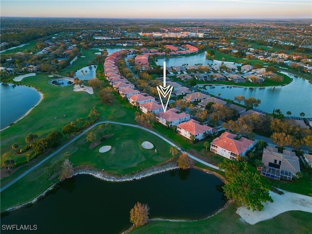 bird's eye view featuring a water view and a residential view