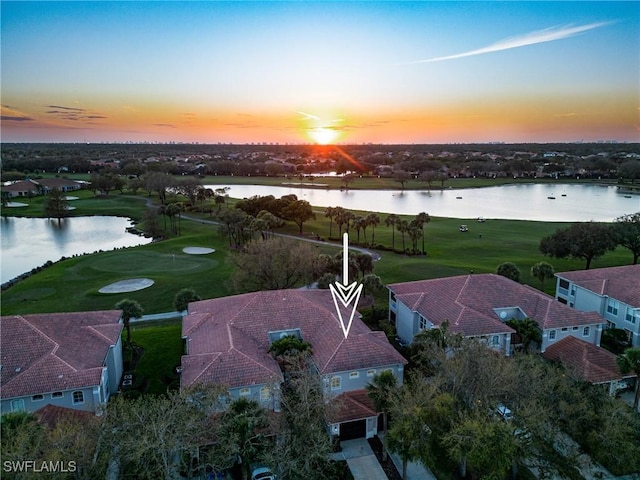 drone / aerial view with a water view and a residential view