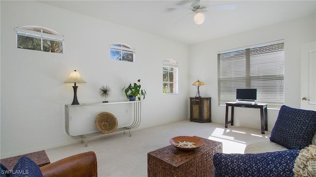 office space with light carpet and ceiling fan