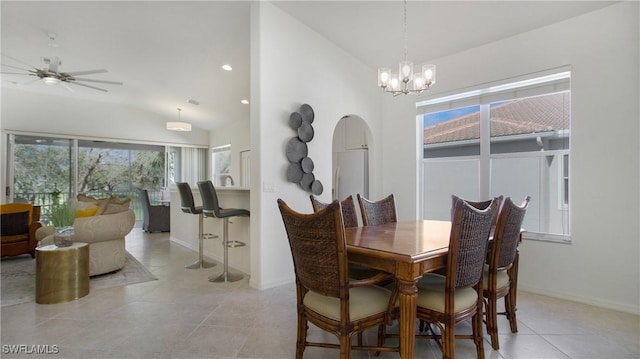 dining room with lofted ceiling, light tile patterned floors, baseboards, and recessed lighting