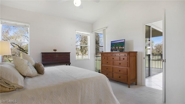 bedroom with lofted ceiling, access to outside, multiple windows, and light colored carpet