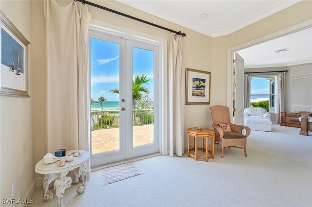 11550 Paige Ct, Captiva, FL 33924 - living area with visible vents, carpet, baseboards, ornamental molding, and french doors