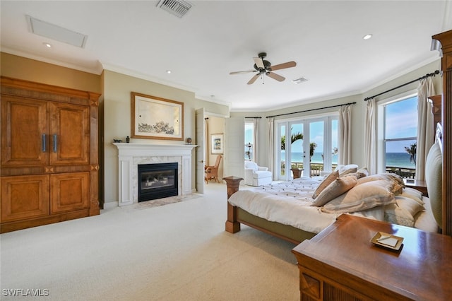 11550 Paige Ct, Captiva, FL 33924 - bedroom with crown molding, light carpet, a fireplace, access to outside, and visible vents