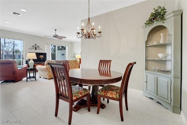 dining room with built in shelves, visible vents, plenty of natural light, and ceiling fan with notable chandelier